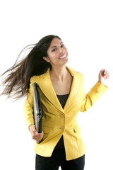 Wall Mural - Happy young brunette student with yellow jacket