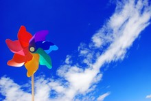 Colorful Pinwheel Against Blue Sky