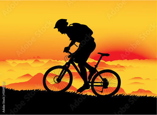 Naklejka - mata magnetyczna na lodówkę Mountain biker at sunset. No transparency