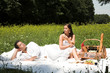 © Lukas Skarits - Young attractive couple having a picknick