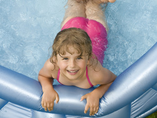 Wall Mural - Happy girl playing in water