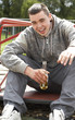 © Monkey Business - Young Man Sitting In Playground Drinking Beer