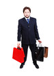 © Jasmin Merdan - Young attractive man wearing suit and holding shopping bags