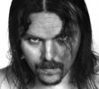 © Jaroslaw Grudzinski - B&W portrait of a young man with long hair and beard