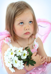 Portrait of the small princess in a pink dress