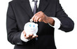 © WavebreakMediaMicro - Close-up of a Businessman putting money in his piggy bank