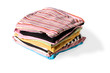 Stack of clothes on white background.