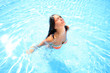 © Netfalls - woman enjoying a swimming pool