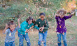© sonya etchison - Girls Playing in the Fall Leaves