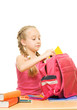 © Nejron Photo - Little schoolgirl packing her rucksack ....