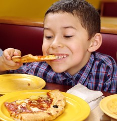 boy eating a pizza