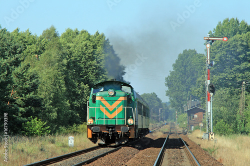Naklejka - mata magnetyczna na lodówkę Rural summer landscape with a passenger train