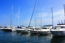 A Row Of Yachts Anchored In The Harbor