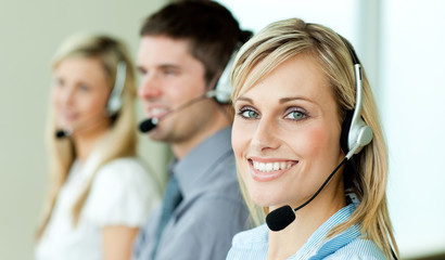 Young businesspeople working with headsets