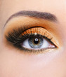 © Valua Vitaly - Woman eye with orange make-up