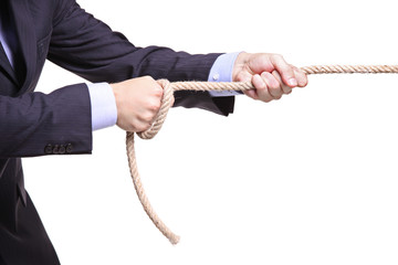 Businessman pulling a rope