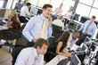 © Monkey Business - View Of Busy Stock Traders Office