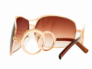 Female sunglasses, isolated over white.