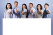 © Gabriel Blaj - Happy group with blank banner and thumbs up