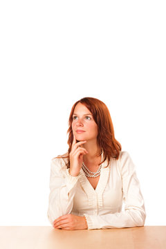 Woman behind a table looking up - tall version