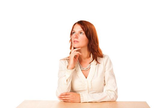 Woman behind a table looking up - wide version