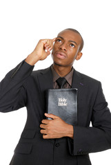 Poster - Man holding a bible whilst thinking