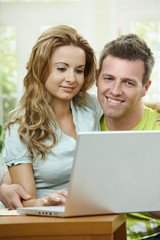 Wall Mural - Couple using laptop computer