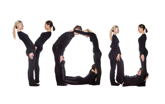 Group of people forming the word 'YOU'