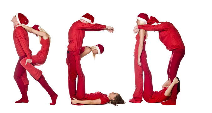 Group of red dressed people forming the word 'RED'.