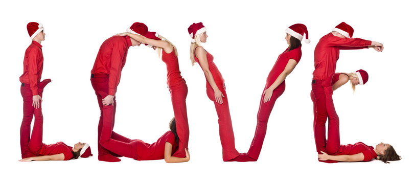 Group of red dressed people forming the word 'LOVE'