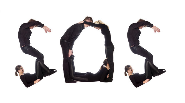 Group of people forming the word 'SOS'