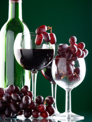 Poster - a glass of red wine and grape..