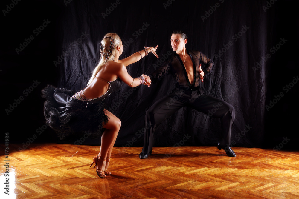 dancers in ballroom against black background - obrazy, fototapety, plakaty 