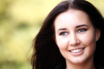 Closeup portrait of a happy young woman smiling