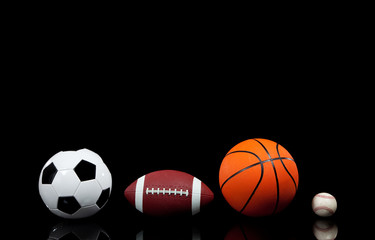 Wall Mural - Sports balls on a black background