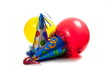 birthday party hats and balloons on a white back ground