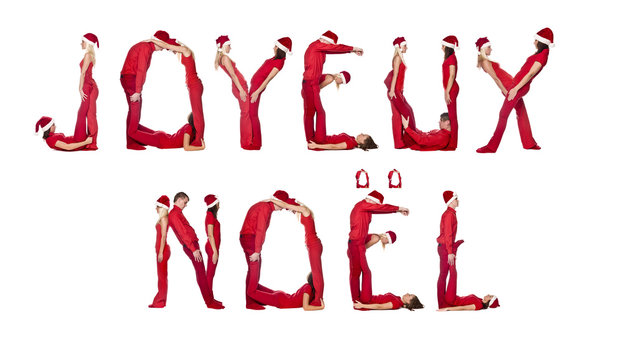 Elfs forming the phrase 'Joyeux Noel'
