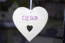 Metalic Heart With Sign Closed In Window Shop