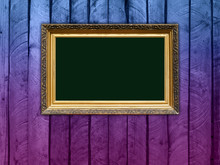 Carved Gilded Frame On Violet Wood Background