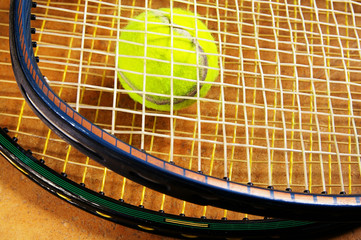 Wall Mural - tennis rackets and a tennis ball, closeup