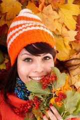 Wall Mural - girl in autumn orange hat on leaf group. outdoor.