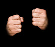 Fists isolated on black background