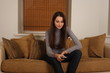 © Jane Doe - a woman with a remote control