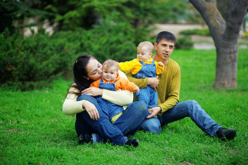 Wall Mural - Happy parents with twins