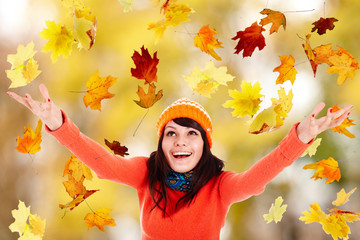 Wall Mural - girl in autumn orange hat with outstretched arm. outdoor.