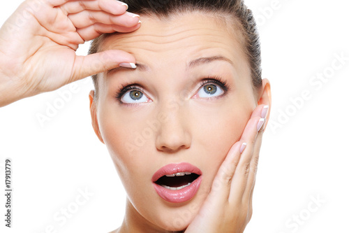 Cuadros en Lienzo young pretty woman squeeze skin on forehead