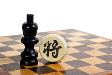 Western And Chinese Chess Pieces Depicting Cultural Difference
