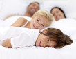 © WavebreakMediaMicro - Family resting in parent's bed
