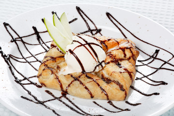 Wall Mural - apple cake and ice-cream on a white plate..