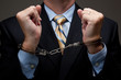 © Michael Flippo - Business man in handcuffs
